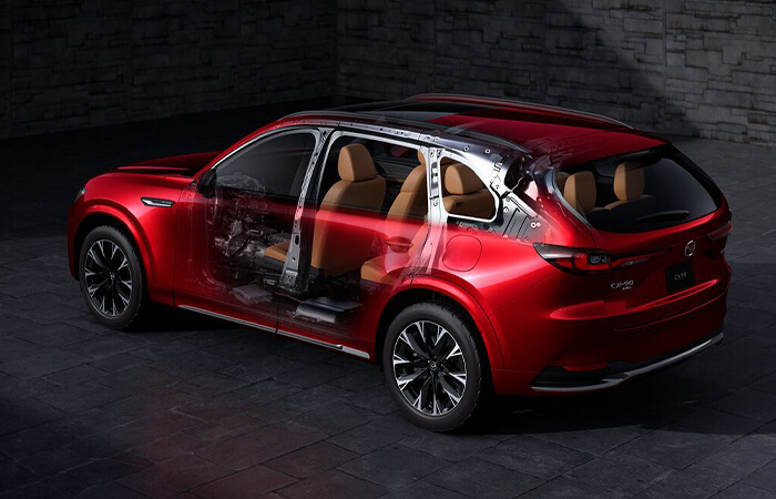 Exterior view of partially transparent CX-90 MEHV reveals interior and design details.