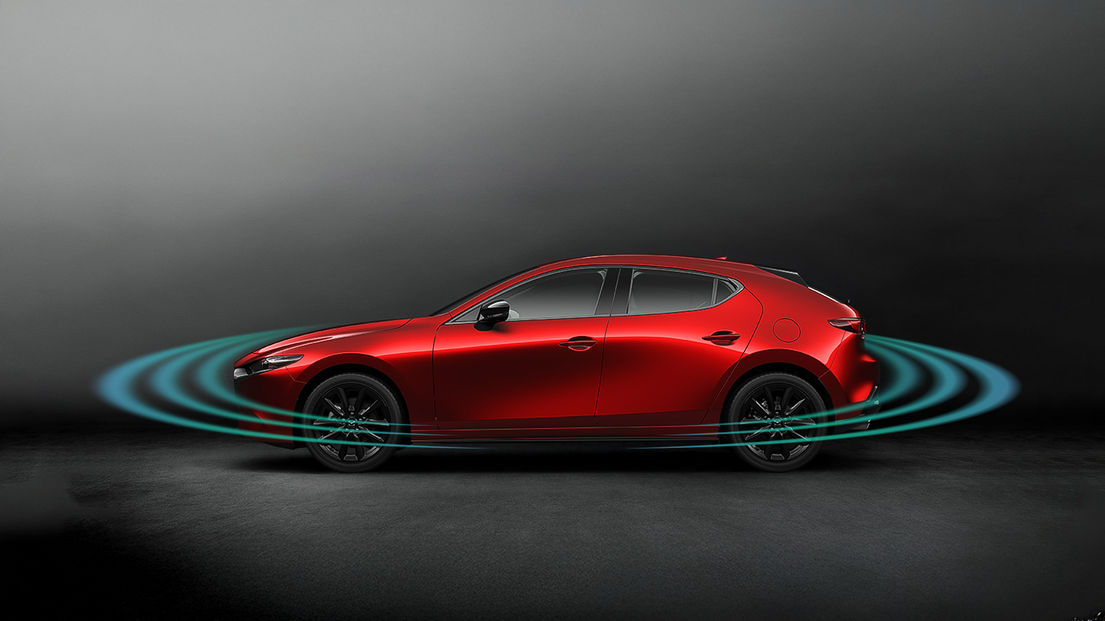 Blurred passenger rear side view of red Mazda3 on highway showing radar pulses radiating outwards from front and back.