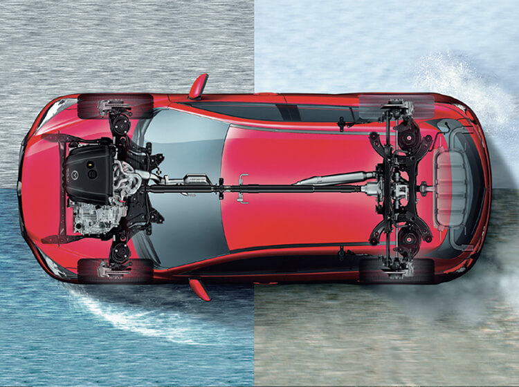 Overhead view of red Mazda with superimposed engine and power train driving on road divided into four sections, each representing a different seasonal road condition 