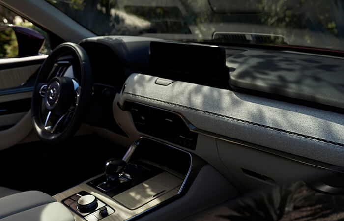 View from passenger’s side of the dash, console, and display screen from inside the CX-90. 