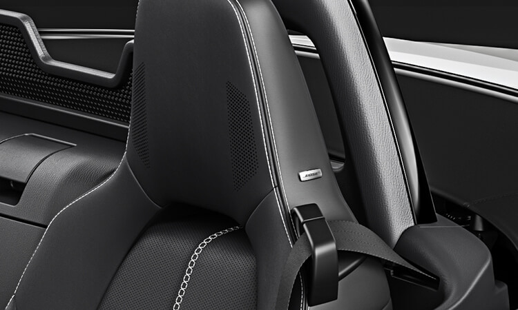 Image of MX-5 ST car seat headrest with integrated audio system.