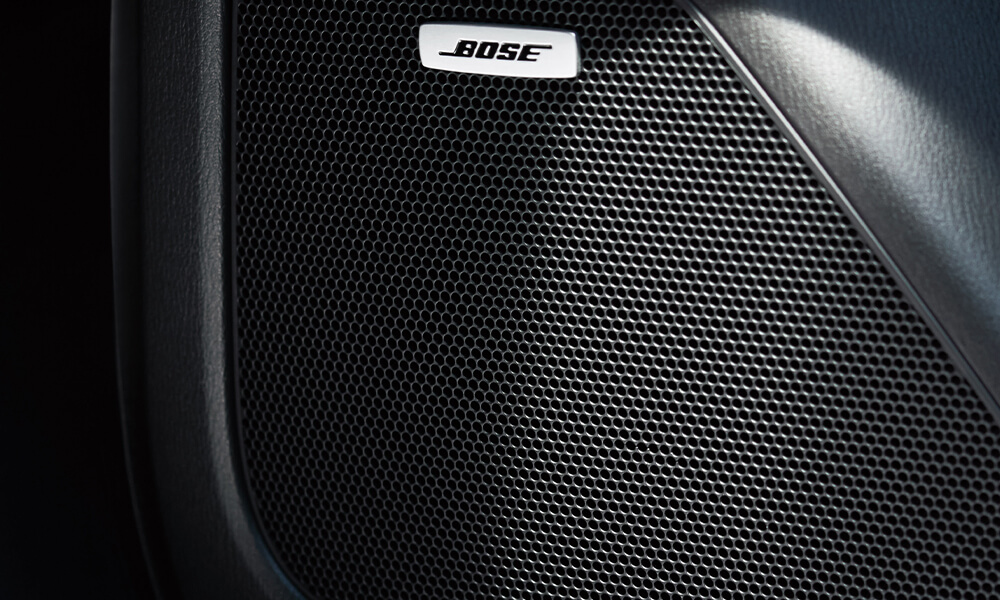 Close-up of Bose speaker in Mazda CX-5 interior.