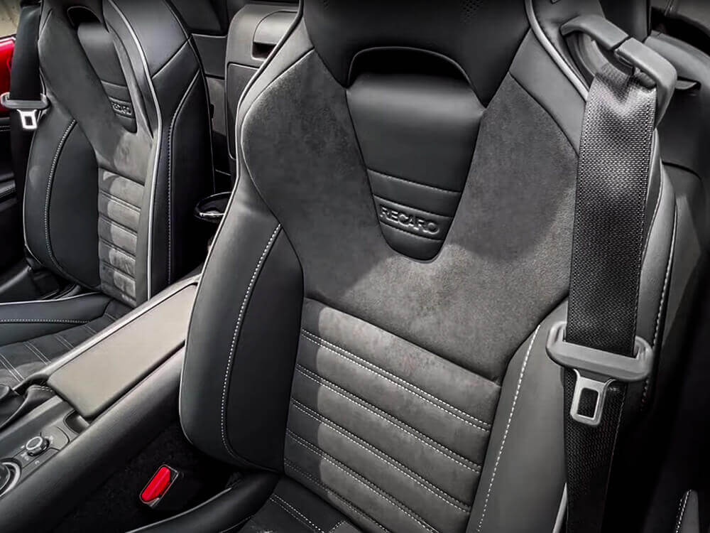 Close-up of a front seat with black leather details in an MX-5 ST.